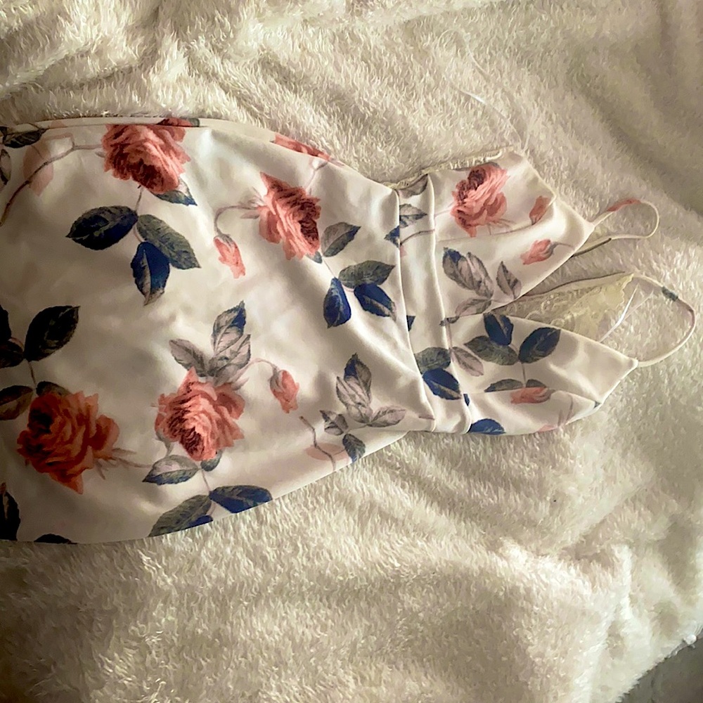 Worn once, beautiful floral dress that is skin tight, above the knees length